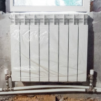 Een verwarmingsradiator aansluiten op een tweepijpssysteem: kies de beste aansluitoptie