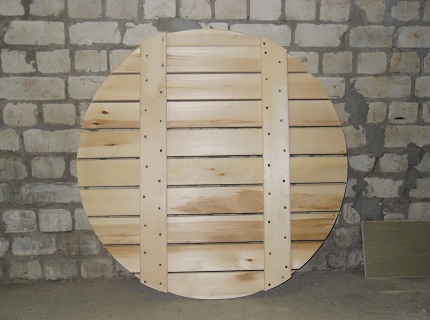 Houten bodembescherming voor een put