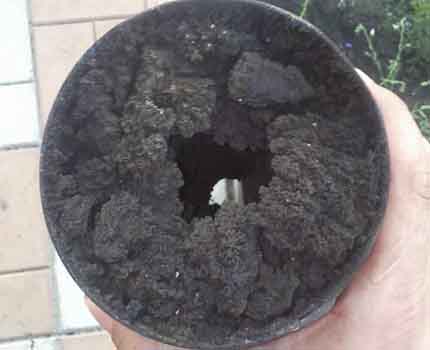 Soot deposits on the walls of the chimney