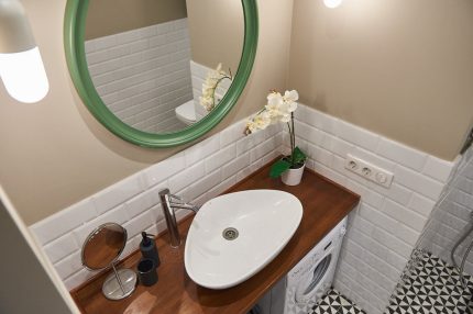 Earthenware sink on wooden countertop.